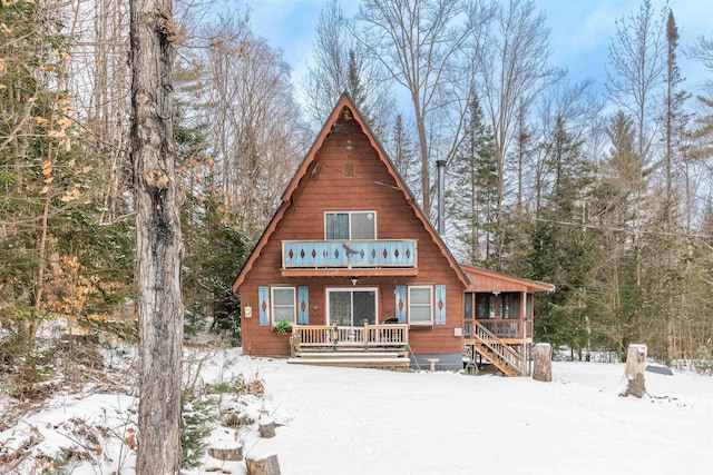 view of snow covered house