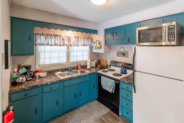 kitchen featuring wood-type flooring, electric range oven, a textured ceiling, white refrigerator, and sink