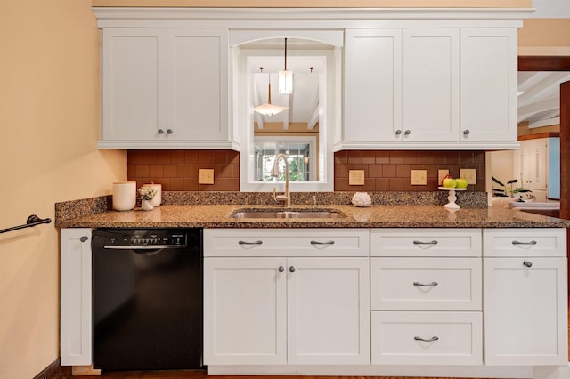 kitchen featuring white cabinetry, dark stone counters, black dishwasher, and sink