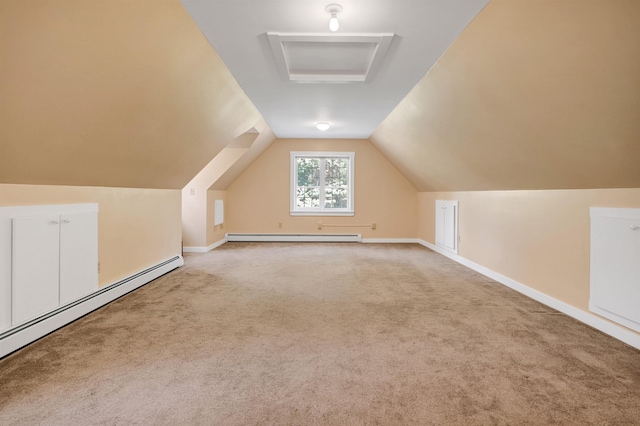 bonus room with vaulted ceiling, a baseboard heating unit, and carpet flooring