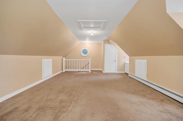 additional living space with vaulted ceiling, carpet floors, and baseboard heating