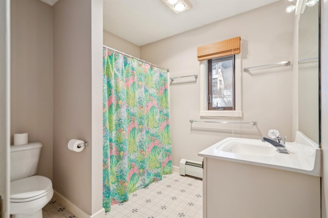 bathroom with toilet, baseboard heating, and vanity