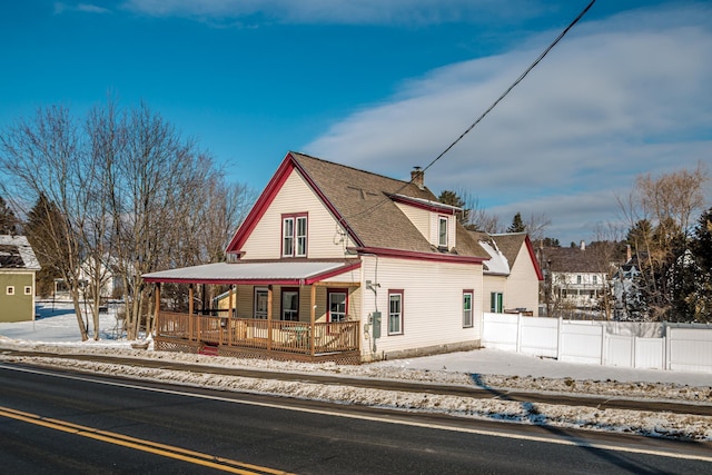 view of front of home featuring a deck and a porch
