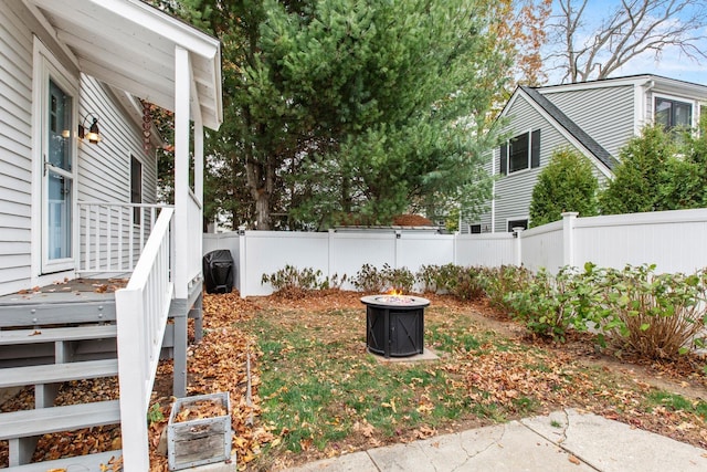 view of yard with an outdoor fire pit