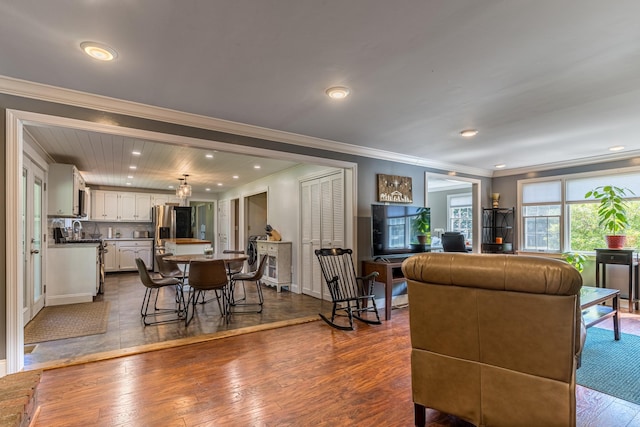 living room featuring crown molding and hardwood / wood-style floors