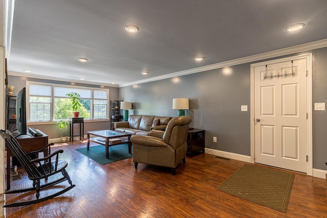 living room featuring dark hardwood / wood-style flooring and crown molding