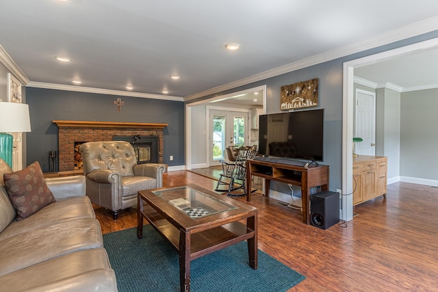 living room with a brick fireplace, crown molding, and dark hardwood / wood-style floors