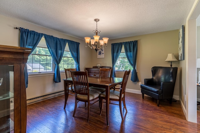 dining space featuring dark hardwood / wood-style floors, a chandelier, and a textured ceiling