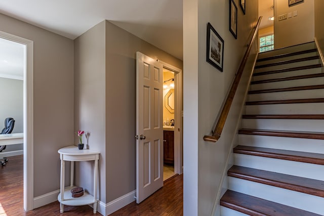 stairway with hardwood / wood-style flooring