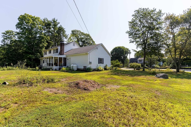 view of yard with a sunroom