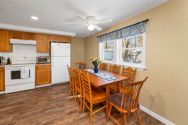 dining space featuring dark wood-type flooring and ceiling fan