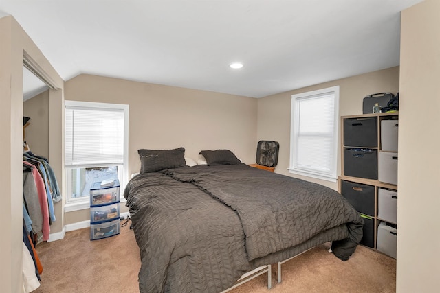 carpeted bedroom featuring vaulted ceiling