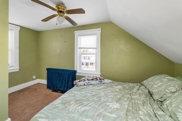 carpeted bedroom featuring ceiling fan and vaulted ceiling