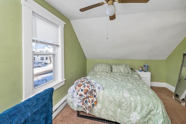 carpeted bedroom with ceiling fan, a baseboard heating unit, and vaulted ceiling