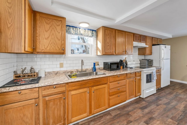 kitchen with decorative backsplash, sink, white appliances, and dark hardwood / wood-style flooring