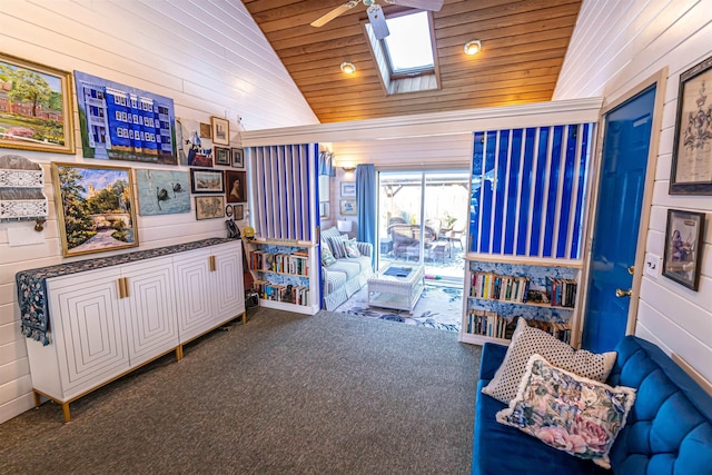 interior space featuring carpet, a skylight, high vaulted ceiling, ceiling fan, and wooden ceiling