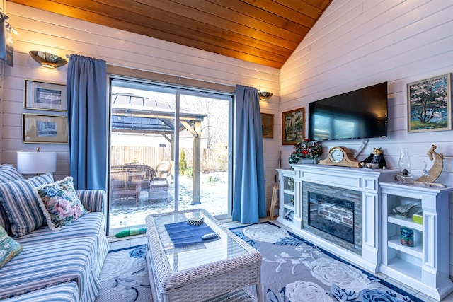 living room featuring wooden ceiling, lofted ceiling, and wooden walls