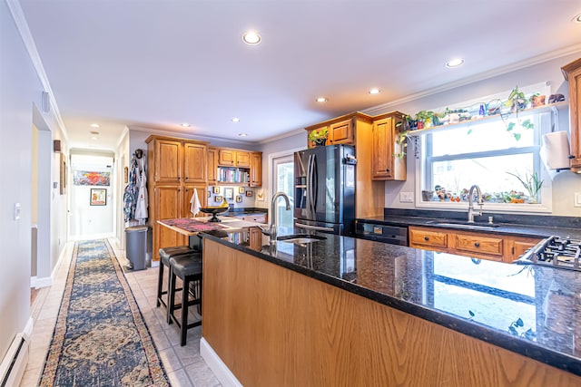 kitchen featuring sink, stainless steel fridge with ice dispenser, and crown molding