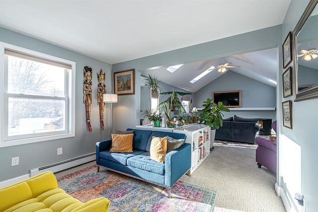 carpeted living room with ceiling fan, a baseboard radiator, and vaulted ceiling with skylight