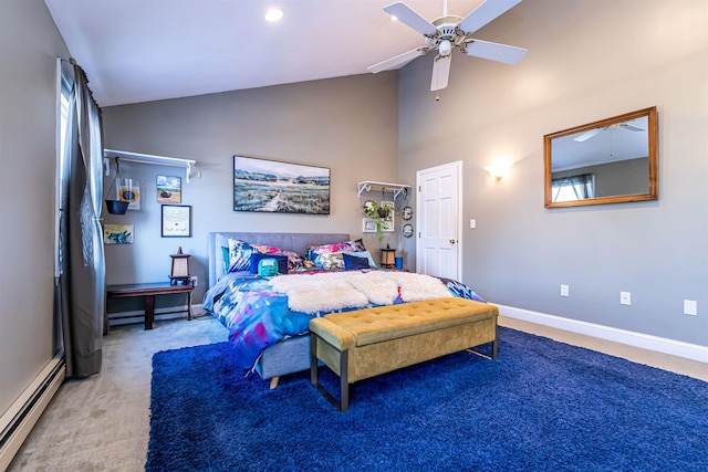 carpeted bedroom with ceiling fan, a baseboard radiator, and high vaulted ceiling