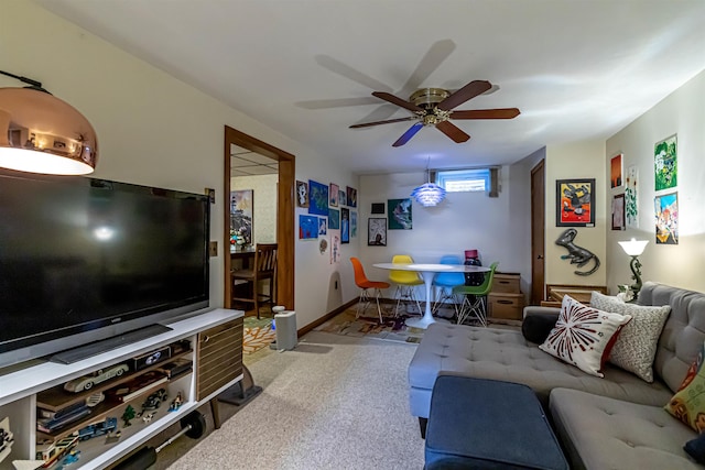 carpeted living room featuring ceiling fan