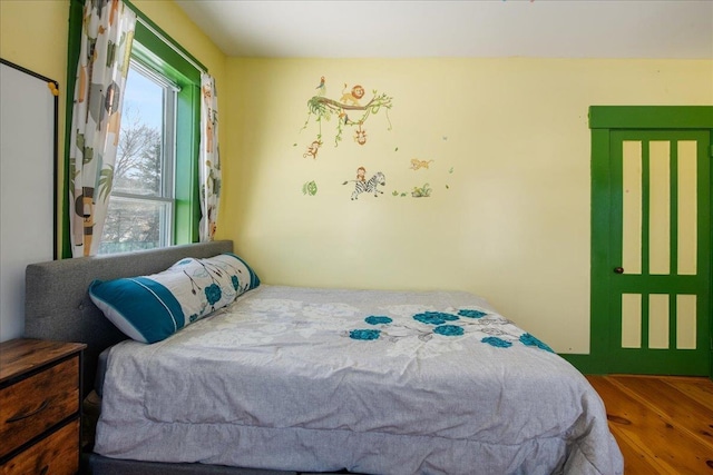 bedroom with hardwood / wood-style flooring