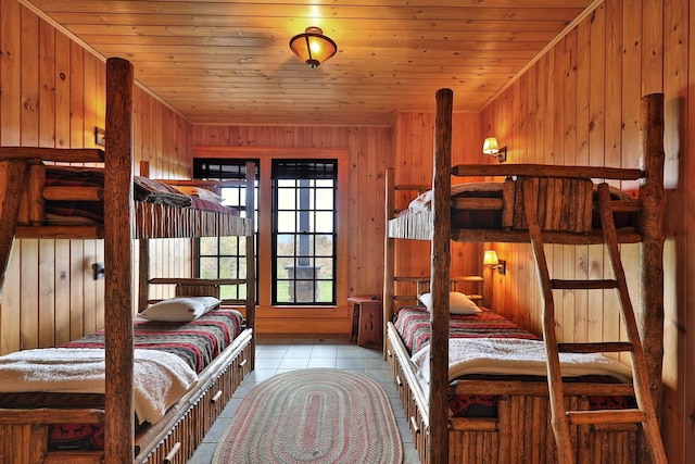 tiled bedroom with wood ceiling and wooden walls