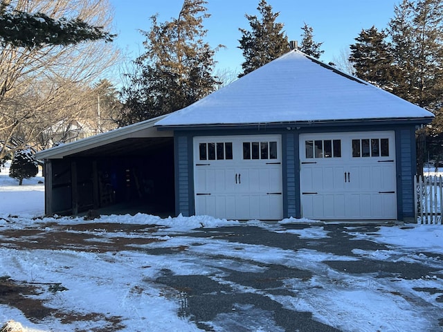 view of snow covered garage