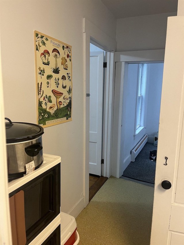 hallway featuring a baseboard heating unit