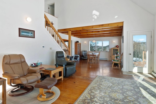 living room with beam ceiling, hardwood / wood-style flooring, high vaulted ceiling, and baseboard heating