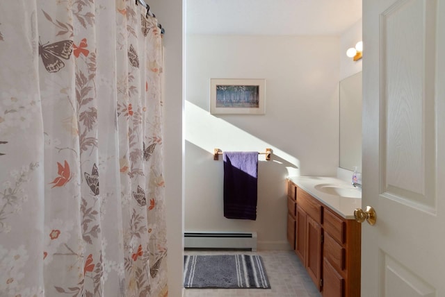 bathroom with vanity and a baseboard heating unit