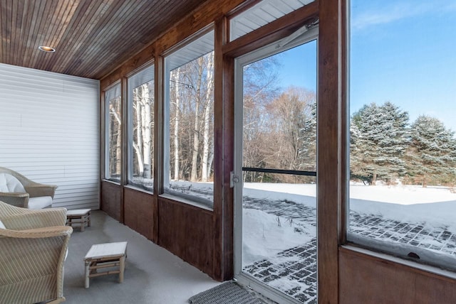 sunroom / solarium featuring wood ceiling