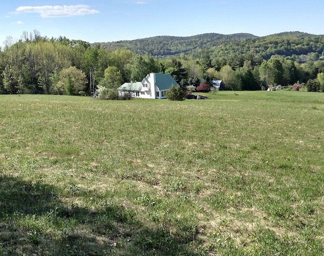 exterior space featuring a mountain view and a rural view