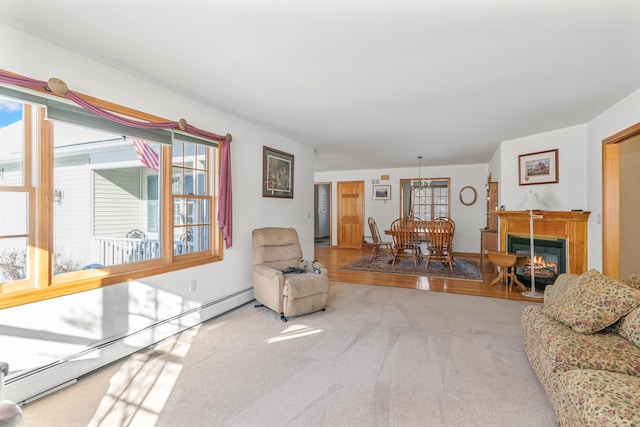 living room featuring a baseboard radiator and carpet flooring