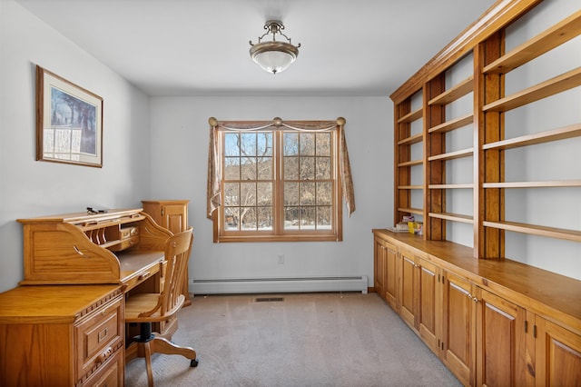 office area featuring light carpet and baseboard heating