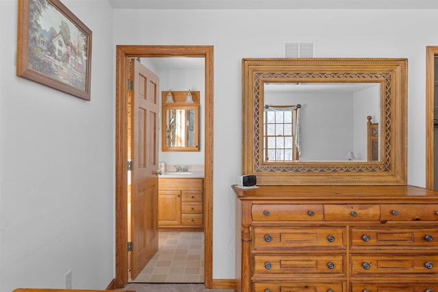 hall featuring light carpet and sink