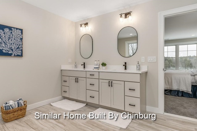 bathroom with vanity and hardwood / wood-style flooring