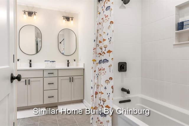 bathroom with tile patterned flooring, shower / bath combo, and vanity