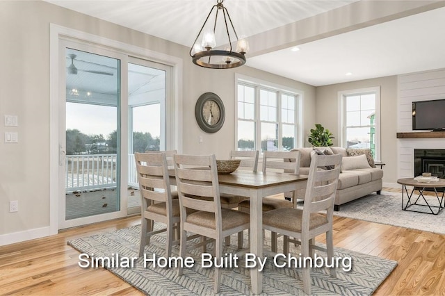 dining area featuring hardwood / wood-style flooring and a notable chandelier