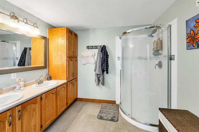 bathroom with walk in shower and vanity