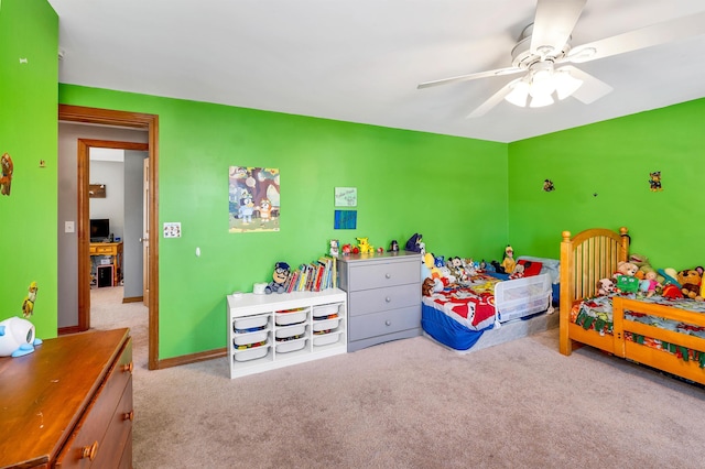 bedroom with ceiling fan and light carpet