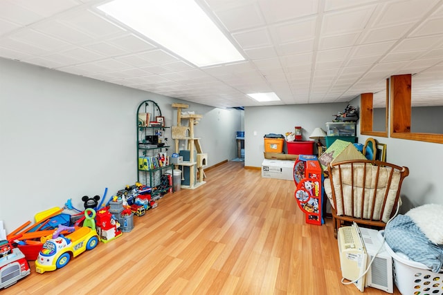 game room with hardwood / wood-style floors