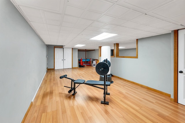 exercise room with wood-type flooring