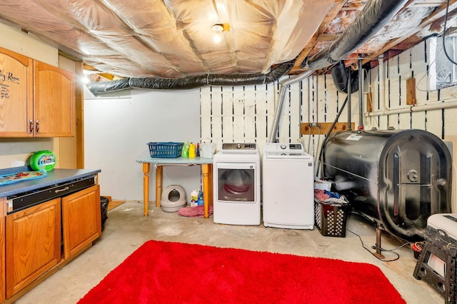 washroom with cabinets and separate washer and dryer