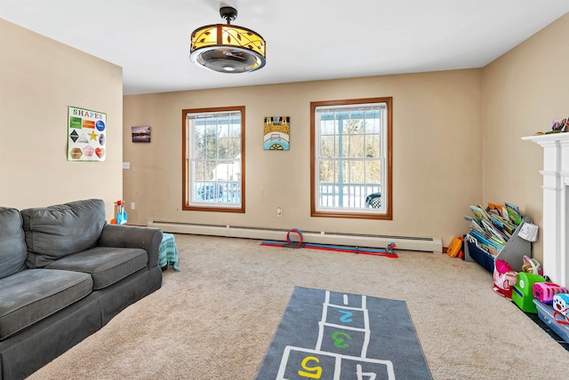 playroom featuring baseboard heating, carpet floors, and a wealth of natural light