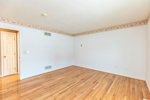 unfurnished room featuring light wood-type flooring