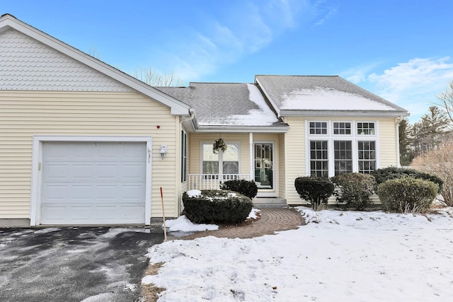 view of front of property with a garage and covered porch