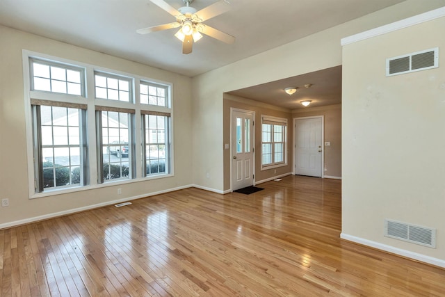 interior space with ceiling fan and light hardwood / wood-style flooring