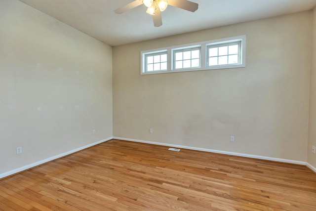 unfurnished room with ceiling fan and light hardwood / wood-style flooring