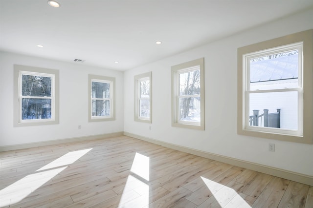 spare room with light hardwood / wood-style floors